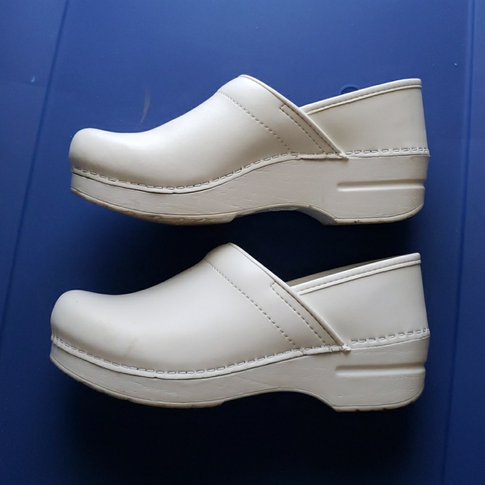 Dansko white leather nursing shoes.